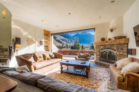 Living room with fireplace and view of box canyon