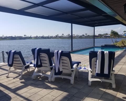 Relax and Enjoy on 60 ft Long Pool Deck with unobstructed waterfront viewing.
