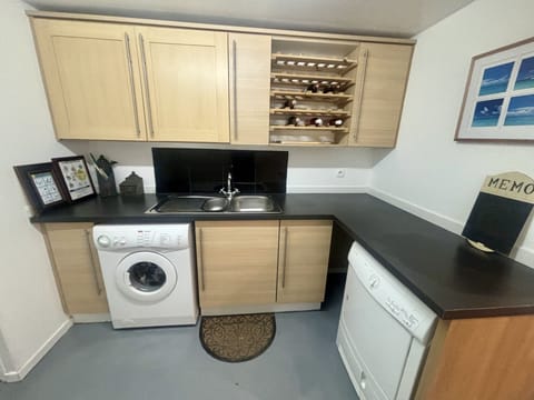 Laundry room with additional fridge and freezer