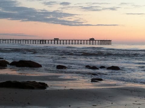 Beach directly in front looking south to the pier, which is a 7 min walk..