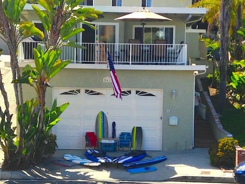Front View w/ Beach Gear. Deck w/ Patio Set and BBQ Above Garage.
