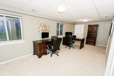 Office area downstairs with workspace for 2 people.
