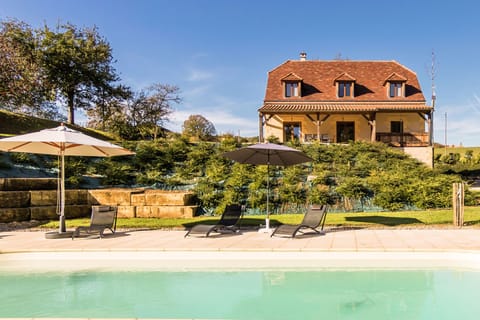 A heated pool, sun loungers