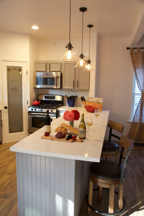 Stocked Kitchen, Gas Range, pantry, Microwave, seats 4 with Counter Top Stools.