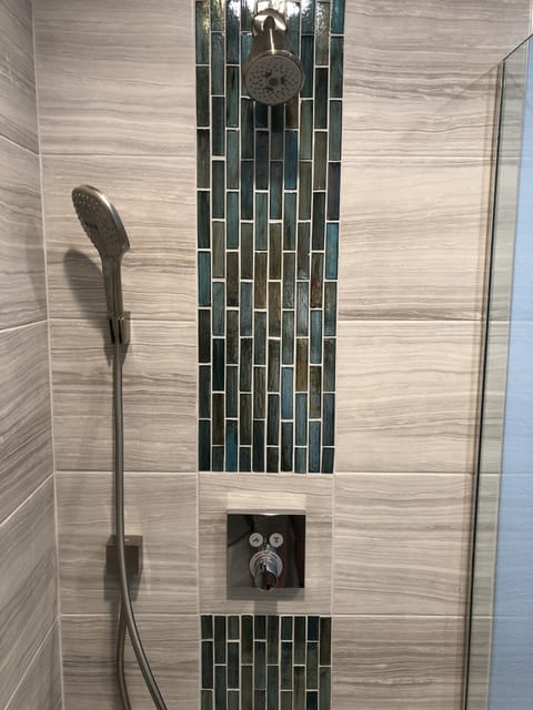 Combined shower/tub, hair dryer, towels, soap