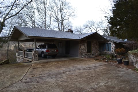 Covered parking and space to the left for three more vehicles.