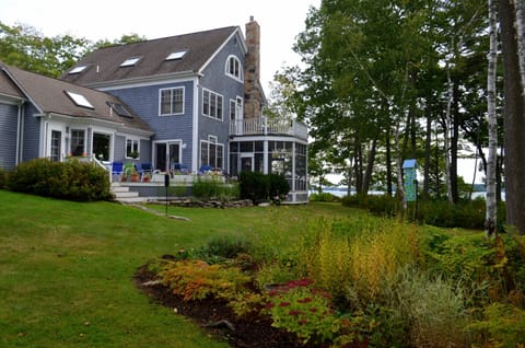 The home's spacious grounds feature gardens and lawns for croquet.