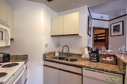 Fully-stocked kitchen with everything needed for cooking.  Granite countertops.