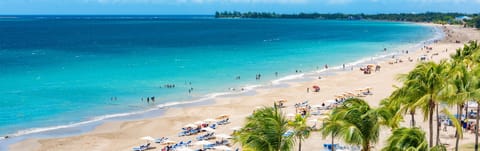 On the beach, sun loungers, beach towels