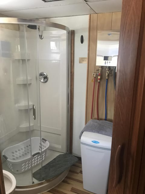 Combined shower/tub, hair dryer, towels, toilet paper