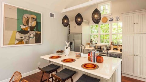 There is bar seating for three for a casual bite...