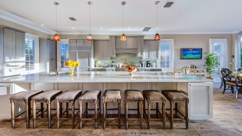 The kitchen island is huge, with bar seating included...