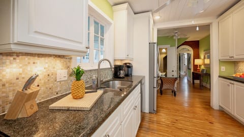 The fully equipped kitchen has stainless steel appliances...