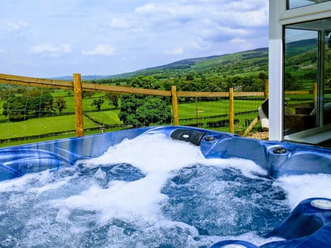 Relax in the hot tub whilst taking in the stunning views