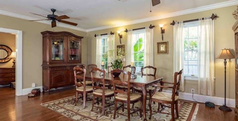 Off the living room sits a spacious dining table, with seating for eight...