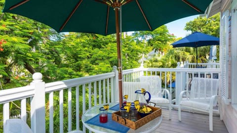 Enjoy an outdoor meal on the back porch with dining set for four...