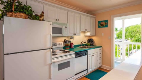 The galley-style kitchen is fully equipped to satisfy the most demanding chef...