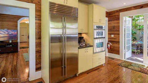 The kitchen has top of the line stainless appliances, including Sub-Zero refrigerator/freezer...