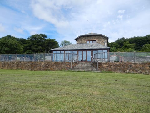 The vast patio at is made safe with toughened glass and hand carved balustrade
