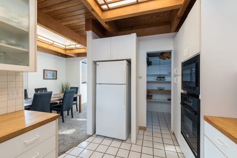 Kitchen with view of pantry and dining room