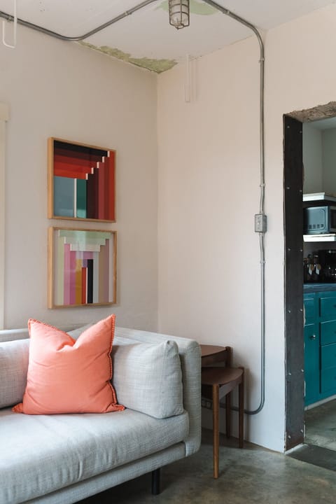 Sofa with modern art – cozy living space with boutique flair.