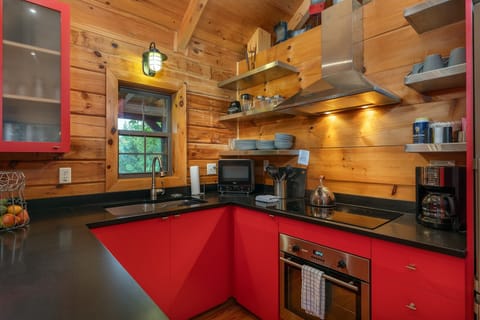 Kitchen with sleek appliances & standard drip-style coffeemaker. Please note: There is NO dishwasher.