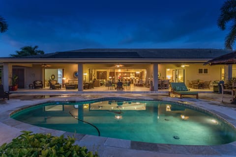 Backyard with Pool and Views of the Lanai at Night