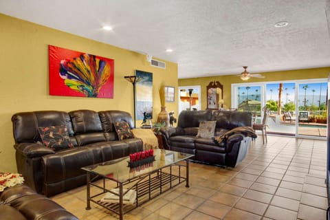 Ample seating in the very comfy living room.  Open up the sliders to enjoy the breeze and view!