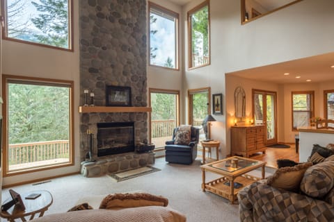 Mt Hood Retreat great room - Great room with vaulted ceilings, stone fireplace and great of the outdoors