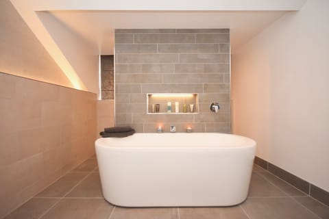 Family luxury bathroom. deep tub, walk in shower, rad, towel rad, WHB & WC