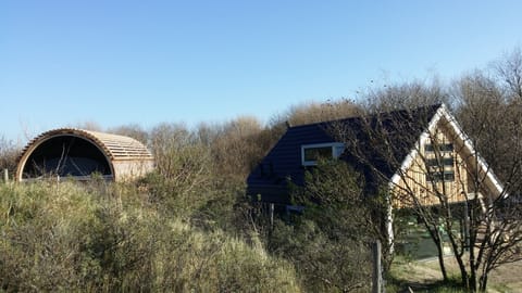 Sauna on the hill and the holiday home sheltered within the dune slack