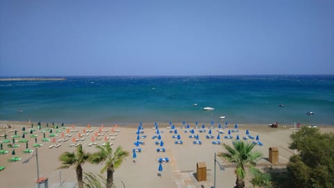 On the beach, sun loungers, beach towels