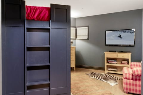 Den features Bunk Beds, Seating Area, Tv with Cable and Dresser.