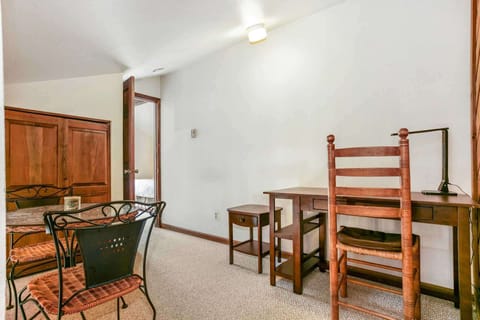 Small gathering area located at the top of the stairs, outside the master suite.