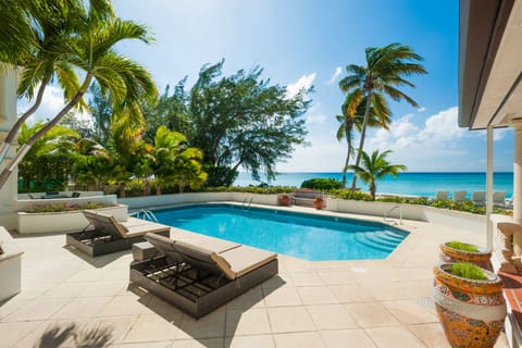 A heated pool, sun loungers