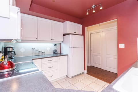 Bright, cozy kitchen with modern appliances and warm lighting