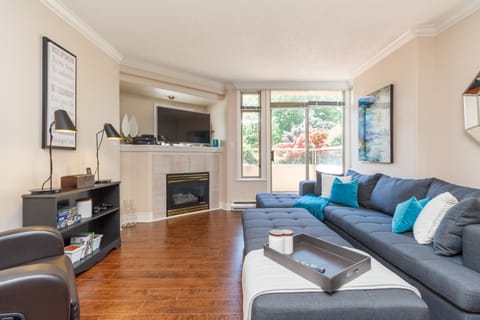 Cozy living room with fireplace and garden views!