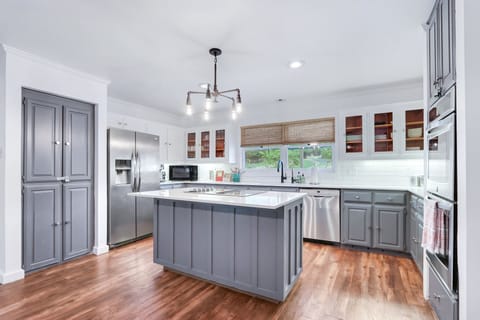Full kitchen with stainless steel appliances