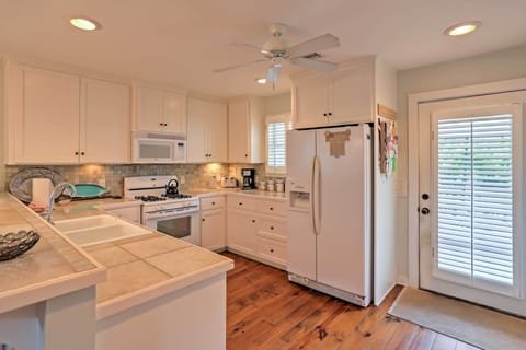 Fridge, stovetop, dishwasher, coffee/tea maker