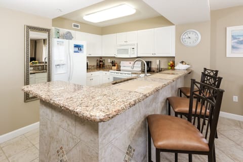 Kitchen - Granite counter tops and decorative tile work make the kitchen look as elegant as it is functional.