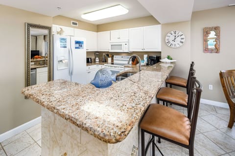 Kitchen - Granite counter tops and decorative tile work make the kitchen look as elegant as it is functional.