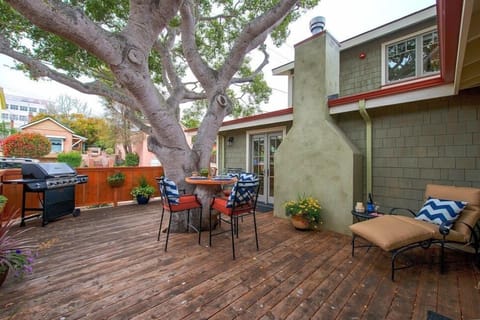 Fenced Backyard Deck with Gas Grill and Seating