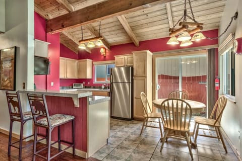 Comfortable kitchen with a cozy conversation table and 2 seats at the bar