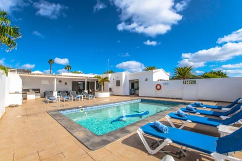 A heated pool, sun loungers