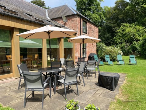 There is large sunny terrace area looking out into the woodlands