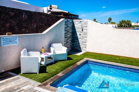 Outdoor pool, a heated pool, sun loungers