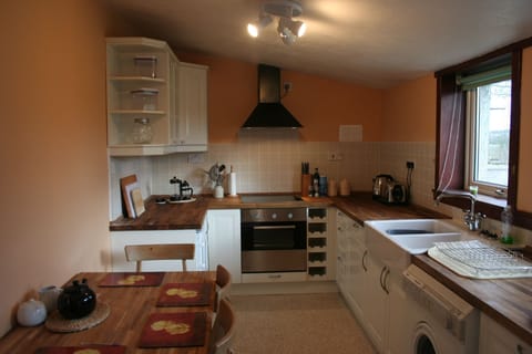 Modern kitchen with small eating area
