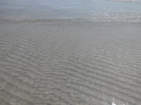 On the beach, sun loungers, beach towels