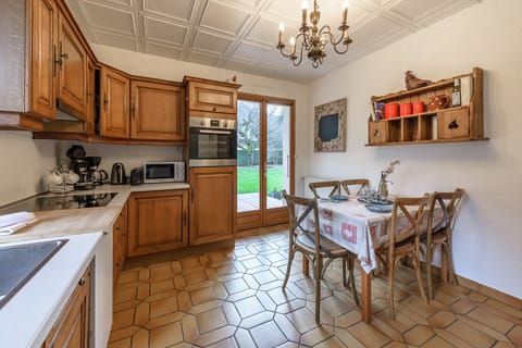 Fitted kitchen with dining area and access to the garden