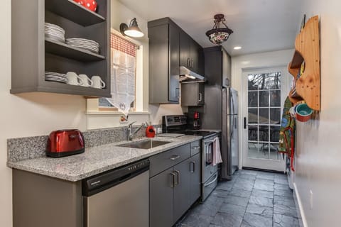 Full kitchen with full size appliances and W/D, private entrance from patio.